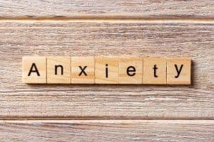 Photo of ANXIETY written on wood block | Online anxiety counseling sc and therapy online in South Carolina