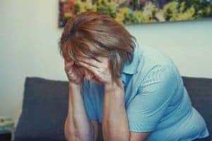 Online counseling can help this older woman who looks sad after learning of her chronic illness diagnosis. She gets online therapy for medical issues with Synergy eTherapy