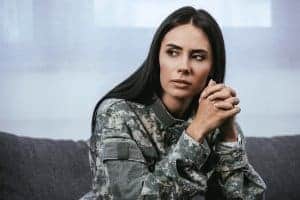 woman in army uniform experiences PTSD. She gets online trauma therapy and PTSD treatment from a Synergy eTherapy online therapist