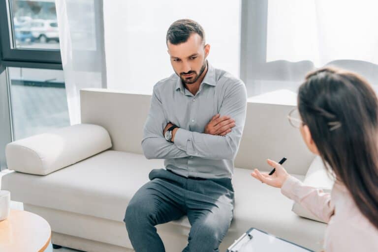 psychologist and patient talking in clinic mental health concept